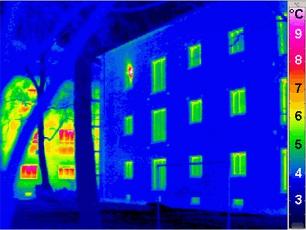 A thermal image of a building. Thermal imaging surveys can identify where heat is being lost from buildings & heat distribution systems. It can also be used to identify faults in other areas including electrical, mechanical and plumbing systems.